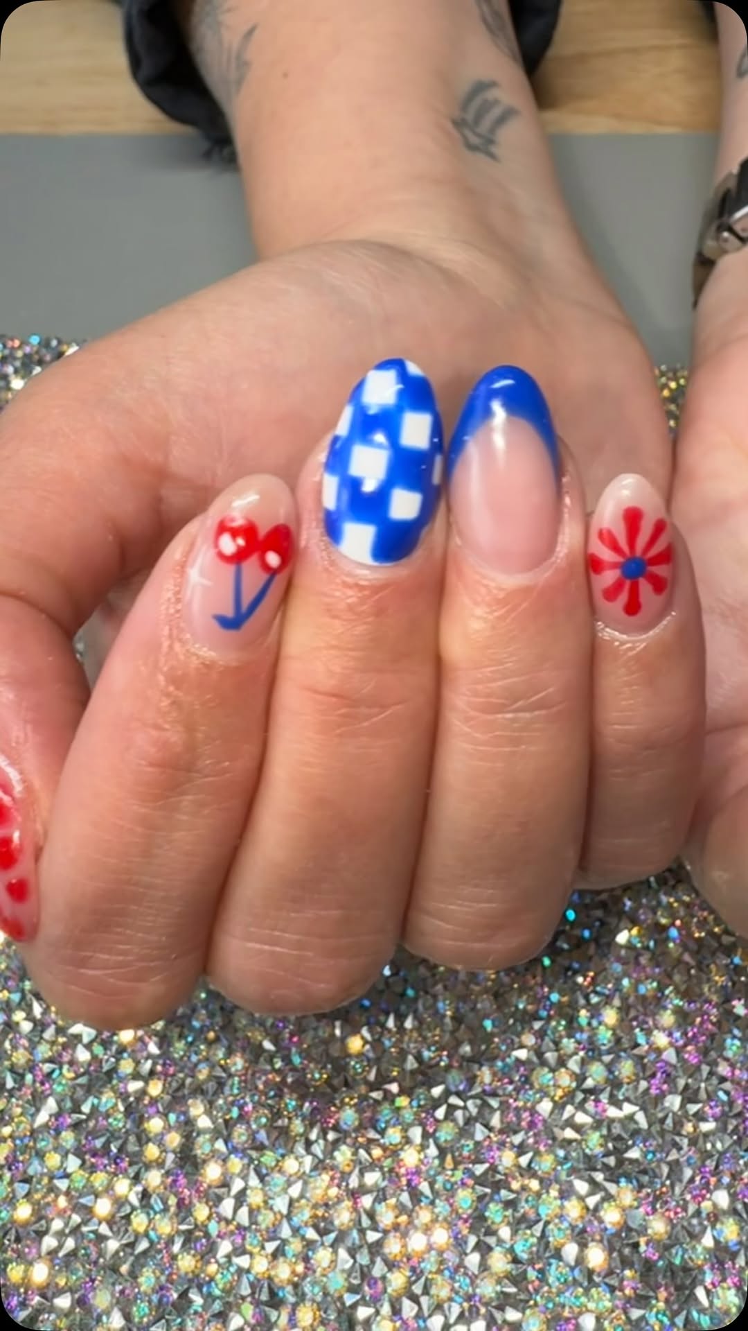 Cherry and cobalt checker nail art